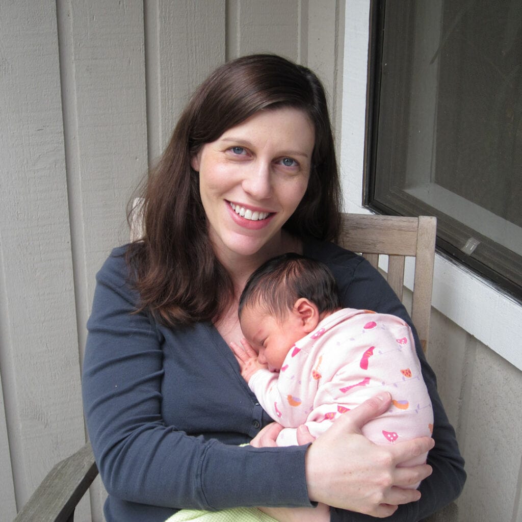fertility nurse holding baby